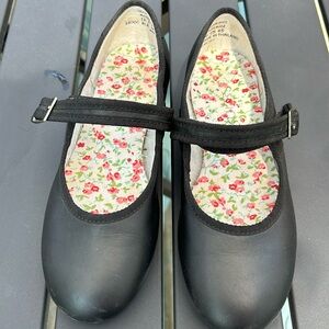 Size 13.5 black leather tap shoes.  In great condition.